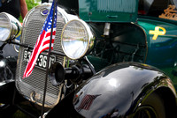 Restored Antique Automobile With Flag