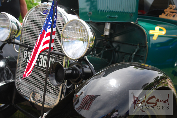 Restored Antique Automobile With Flag